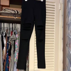 Zella live in leggings with holes in front.